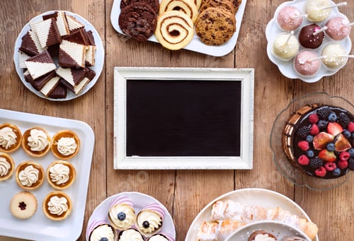Preview: Picture frame and cake, cookies, tarts, cupcakes. Copy space.