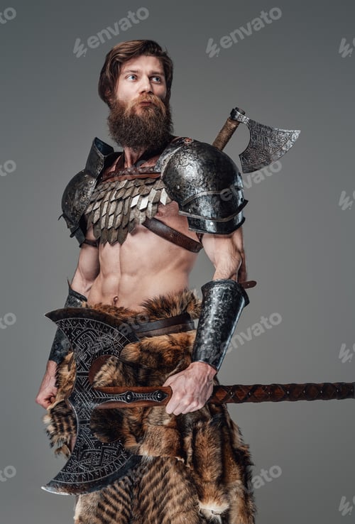 Preview: Proud scandinavian soldier from the past wearing armour and holding axe