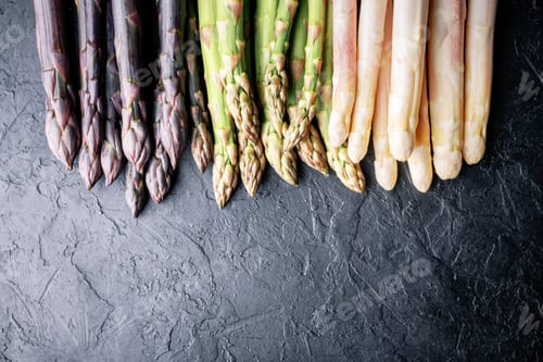 Preview: Green asparagus sprout on black board