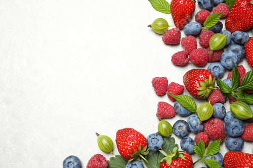 Preview: Mix of fresh berries on light table, flat lay. Space for text