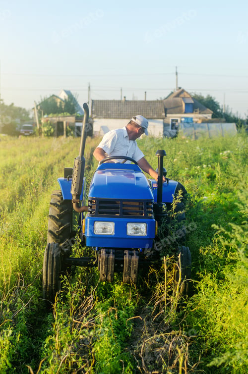 Preview: A farmer on a tractor drives across the farm field and harvests. Farming, agriculture. Improving agr