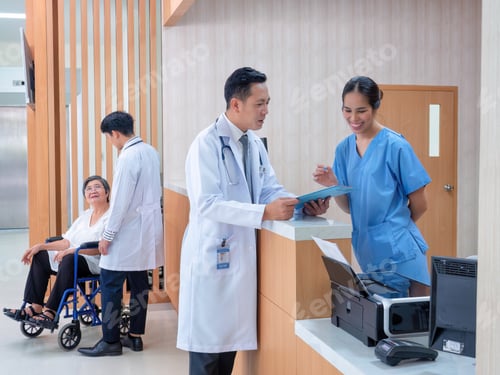 Preview: At hospital hall patient sit waiting information counter doctor speaking to administrative crew