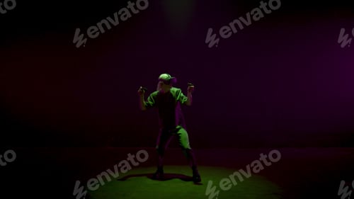 Preview: Neon man experiencing vr in cyberspace. Excited gamer using controllers playing