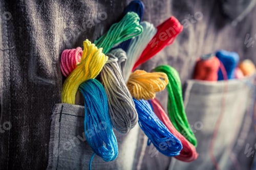 Preview: Colorful Thread Spills from Grey Fabric Pocket