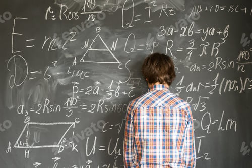 Preview: Boy writting on black board