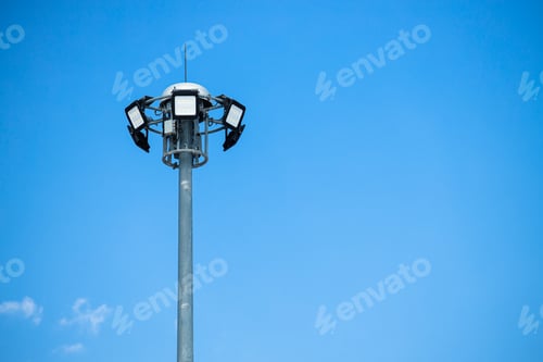 Preview: High power LED outdoor for street lamp post flood light pole on clear blue sky copy space.