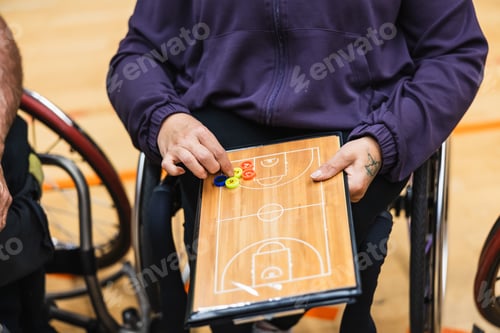 Preview: Wheelchair basketball coach developing game strategy