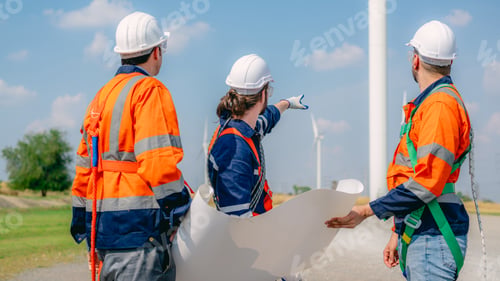 Preview: Professional engineer technician working outdoor at wind turbine field