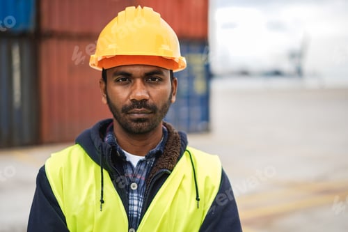 Preview: Indian man working at industrial port outdoor - Focus on face