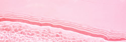 Preview: Background, texture of transparent pink water with seething ripples , waves
