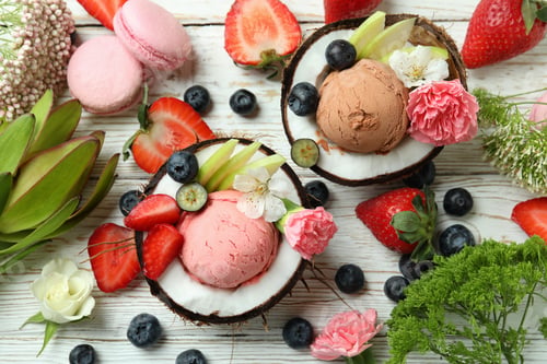Preview: Concept of delicious fruit ice cream on wooden table
