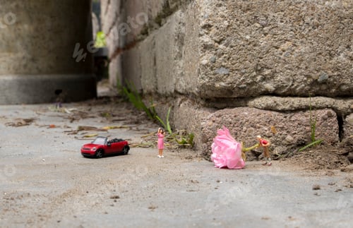 Preview: little figure on the stret with a rose for his love one