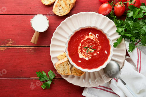 Preview: Soup. Tomato cream soup or gazpacho with herbs, seasonings, cherry tomato and parsley in white bowl