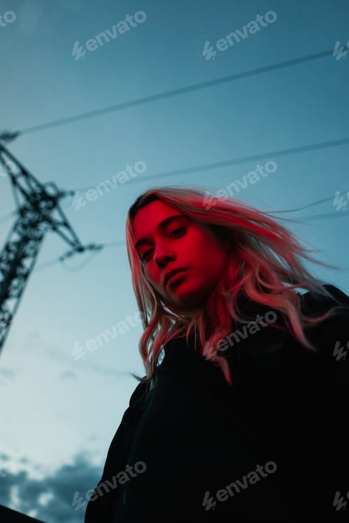 Preview: Thoughtful blonde woman in dusk