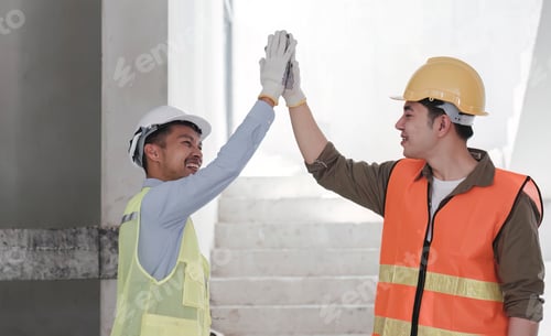 Preview: Businessman handshake with engineering in construction renovate building site. Engineer or architect