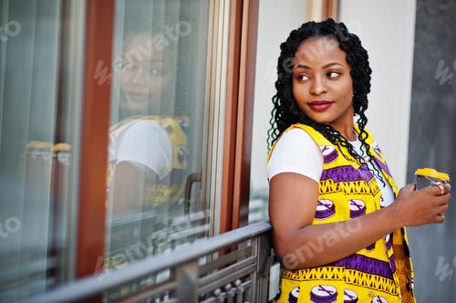 Preview: African woman in yellow