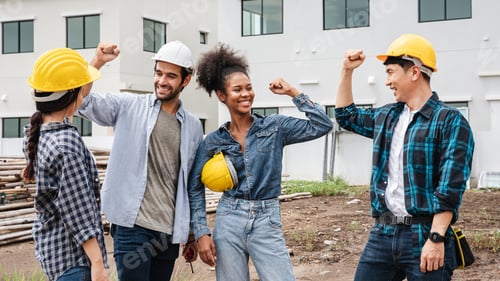 Preview: A supervisor giving a handshake on the construction site as a sign of collaboration, partnership,