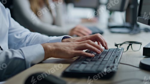 Preview: Closeup hands typing pc keyboard in office. Man manager working surfing internet
