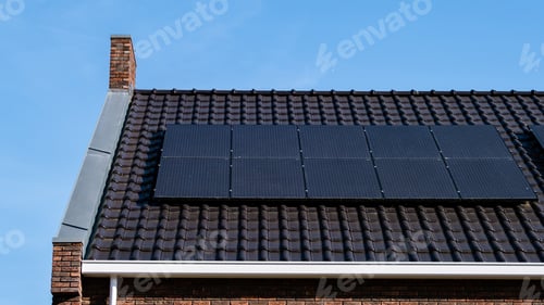 Preview: Newly build houses with solar panels attached on the roof against a sunny sky