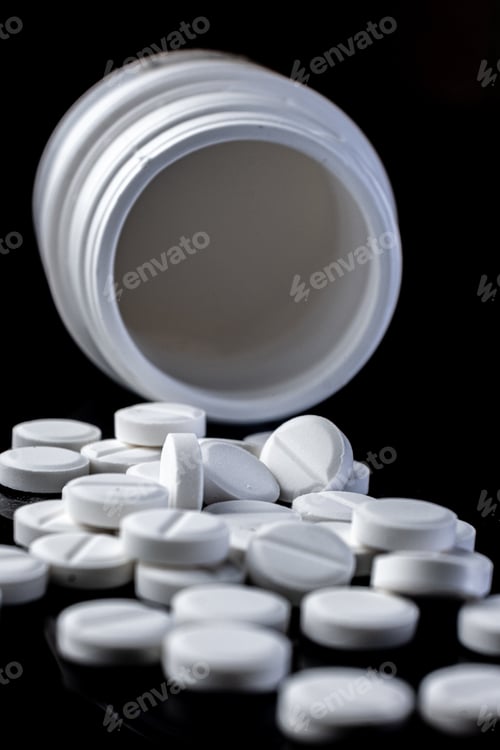 Preview: vertical view of a bottle with white pills