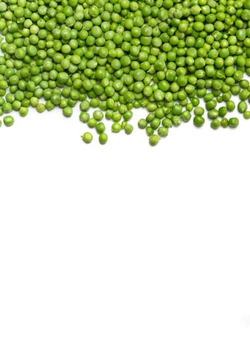 Preview: Fresh green peas are scattered on a white background, top view, copy space.