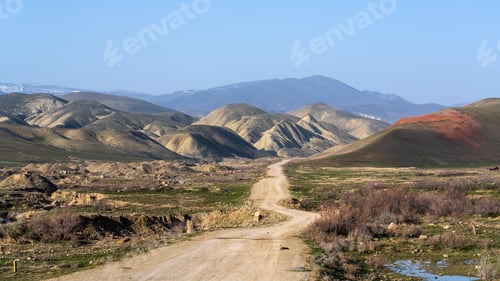 Preview: Dirt road leading to the mountains