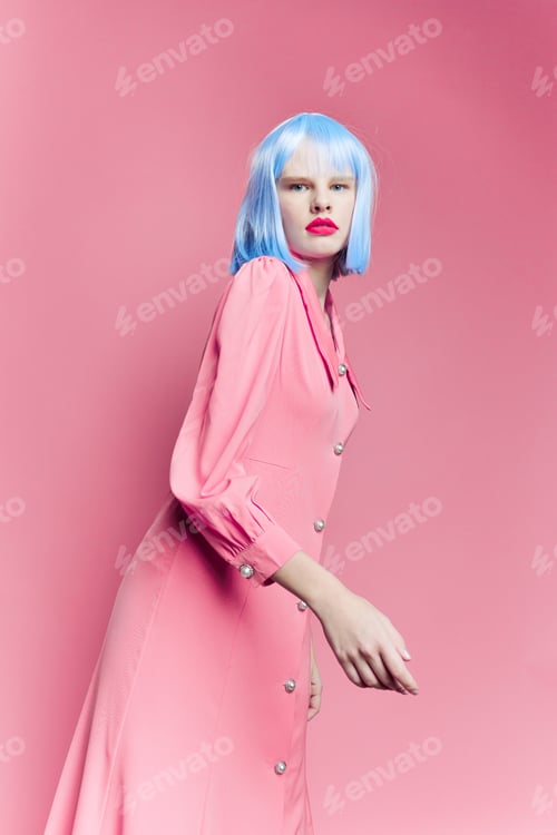 Preview: glamorous woman in blue wig pink dress red lips Lifestyle posing
