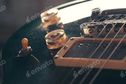 Preview: Electric guitar body and neck detail on wooden background