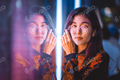 Preview: Pretty asian woman portrait with led lights