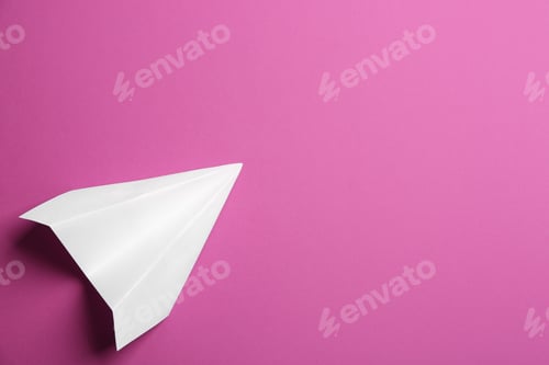 Preview: White paper plane on purple background, top view. Space for text