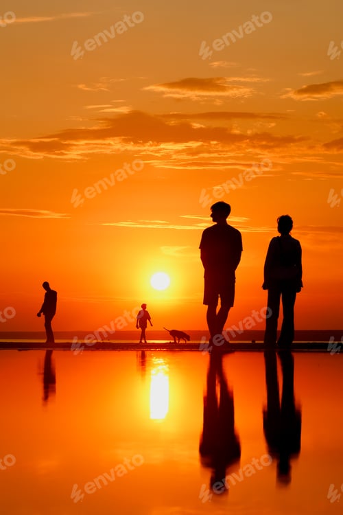Preview: Silhouettes of people against sky seascape sunset sky on sea or ocean