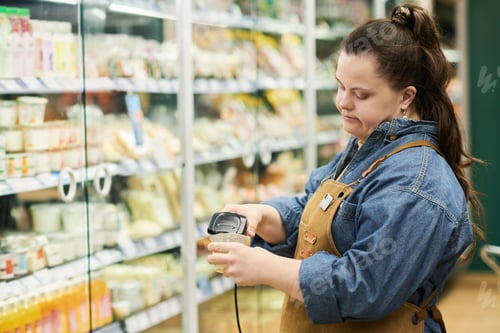 Preview: Woman with Down Syndrome in Supermarket Scanning Codes