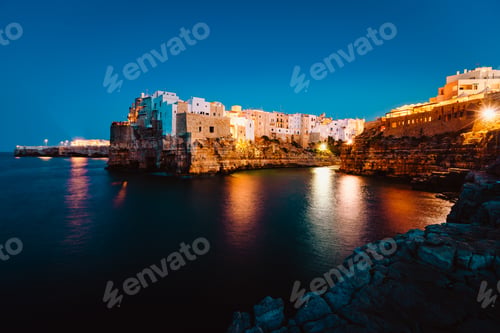 Preview: Night view of the village of Polignano a Mare illuminated by the lights