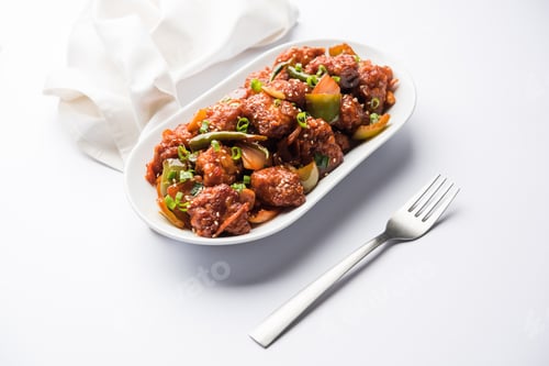 Delicious Chicken Manchurian Dish on White Plate