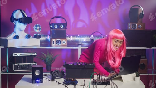 Preview: Smiling musician standing at dj turntables mixing sounds