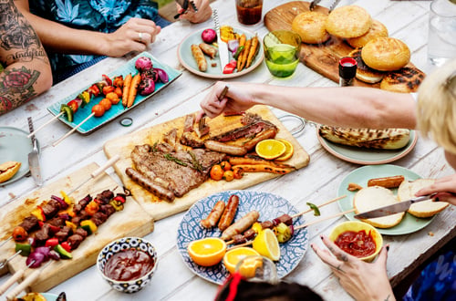 Preview: Closeup of homemade grilled food on wooden table summer party
