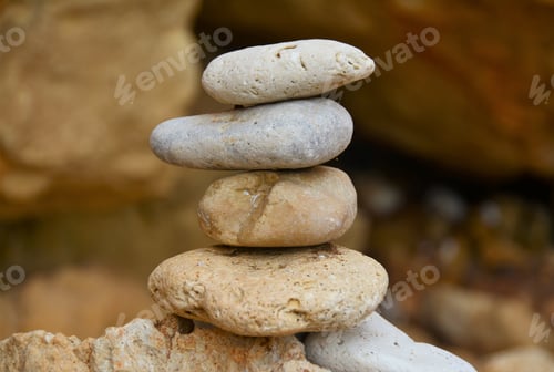 Preview: Closeup shot of a stack of stones on the blurred background