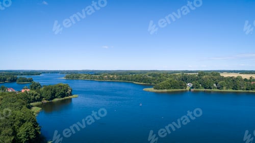 Preview: Aerial view of a country side with agricultural fields and a lake