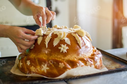 Preview: Woman's hands touch decorated bread