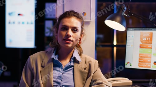 Preview: Young entrepreneur working in business office at night