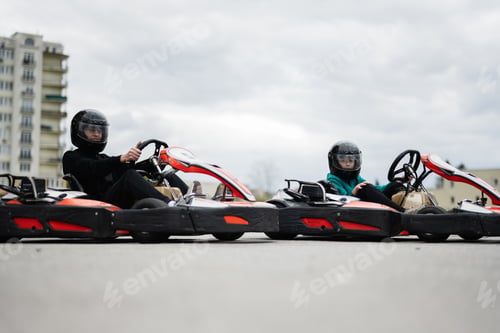 Preview: Children Enjoying Go-Kart Racing Outdoors for a Fun and Exciting Adventure