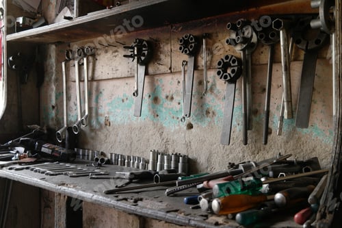 Preview: Selective focus of wrenches on an old wooden shelf