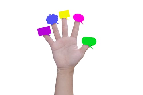 Preview: Multicolor speech bubbles on child hand fingers isolated on white background, with clipping path.