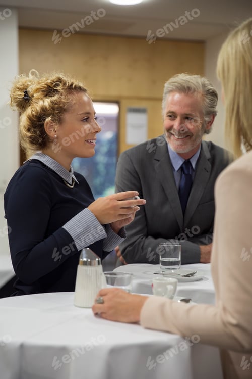 Preview: Colleagues taking a break enjoying refreshments