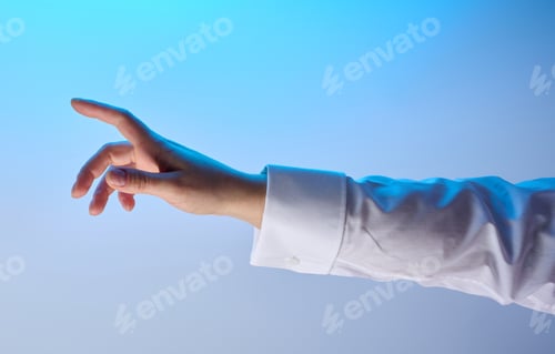 Preview: Female hand in white shirt with raised index finger on white background