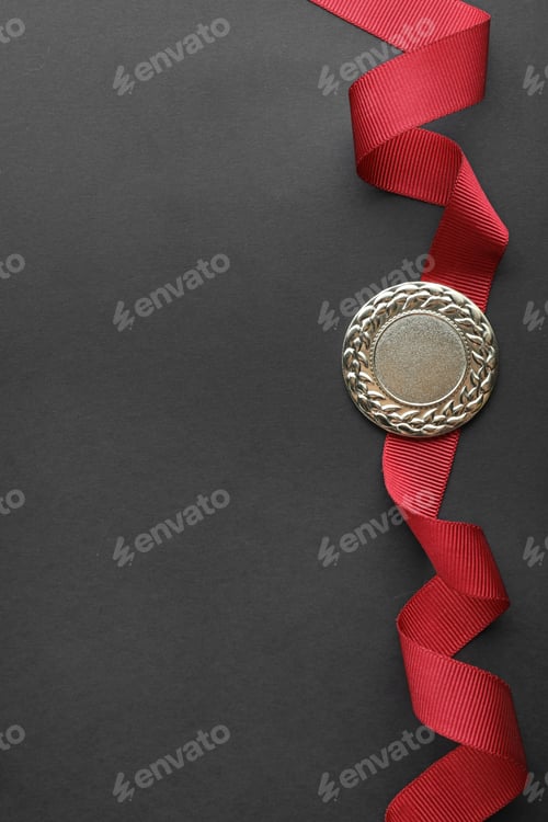 Preview: Gold medal on black background, top view with space for text. Symbol of victory