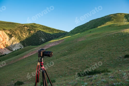 Preview: Photo camera on the mountainside, preparing for shooting