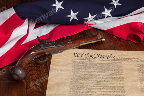 Preview: Antique pistol with 13 star flag and the constitution of the United States on dark wood background