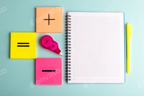 Preview: front view different signs on colorful stickers with copybook on iced-blue background math color
