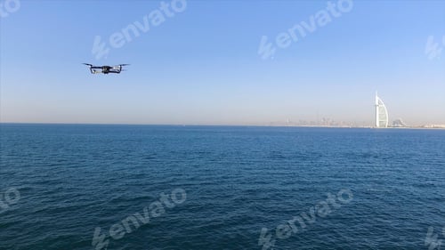 Preview: Aerial view of Burj Al Arab hotel, famous luxury resort in Dubai, on blue sky background. Stock